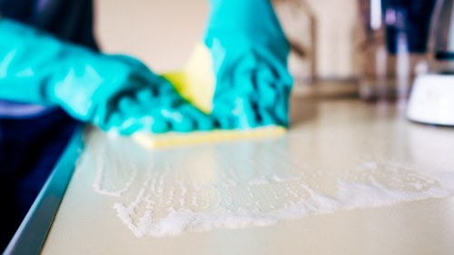 Sorted recycling bins for paper, plastics and glass at a commercial site